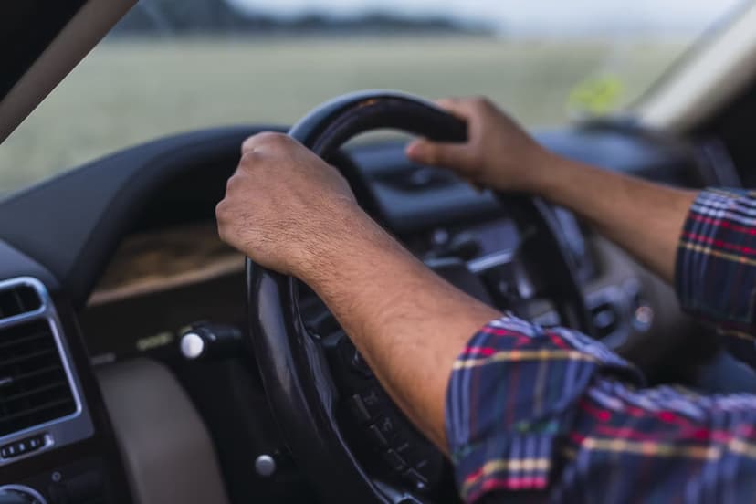 Driver at the wheel of a car.